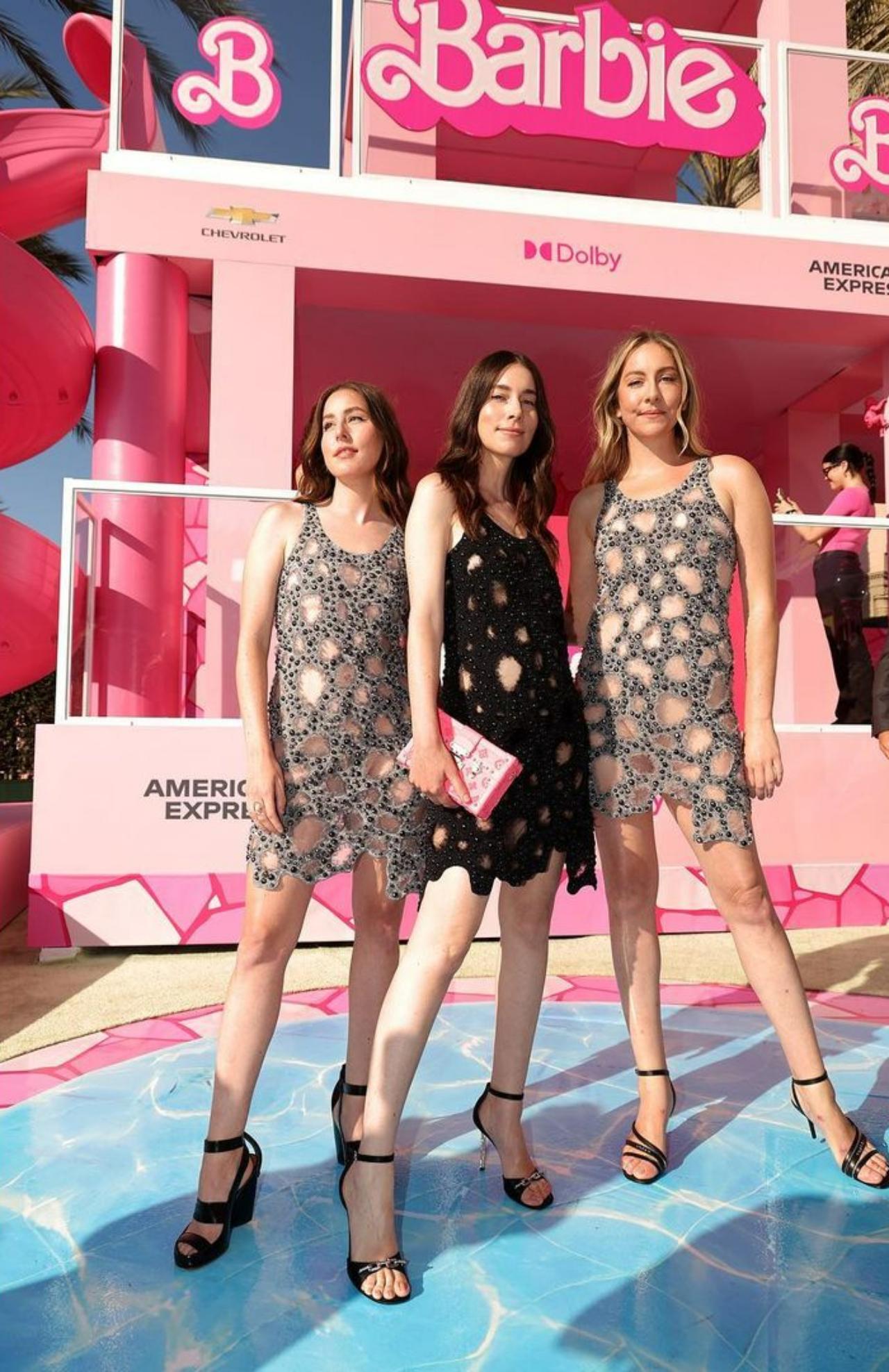 Rock band, the Haim sisters looked absolutely stunning in cut-down silver and black dresses from Louis Vuitton